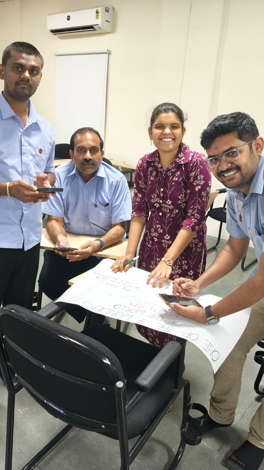Thermopads employees collaborating on a workplace problem-solving exercise