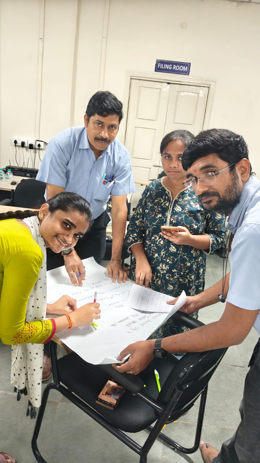 Thermopads employees designing hand-sketched presentations during the workshop